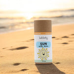 Family using natural baby sunscreen stick for safe mineral sun protection outdoors
