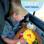 Baby sensory backpack designed for travel, featuring a bear design with interactive elements and safety straps.