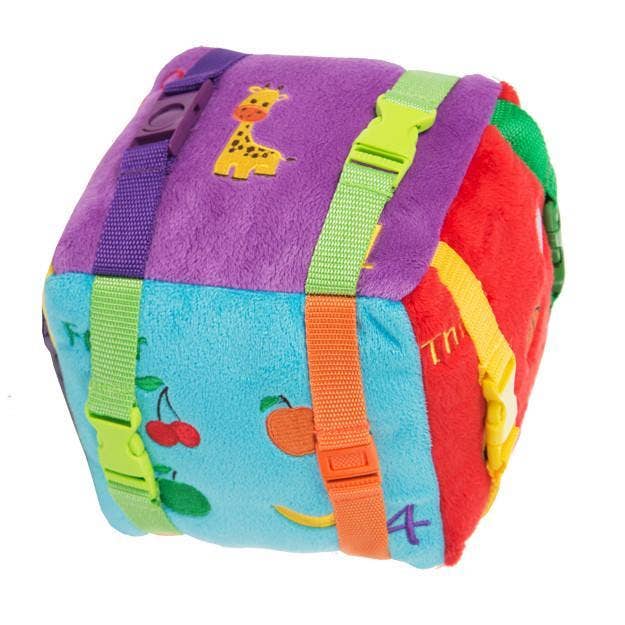 Plush sensory cube toy featuring colorful textures, snaps, and buckles for early learning and sensory engagement.