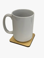 funny refrigerator magnet as a coaster under a coffee mug