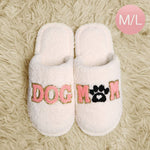 Dog mom indoor slippers with soft plush material, featuring the word 'DOG' and a paw print design.