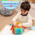 Child engaging with a Plush Sensory Cube Toy featuring 12 buckles to strengthen fine motor skills.