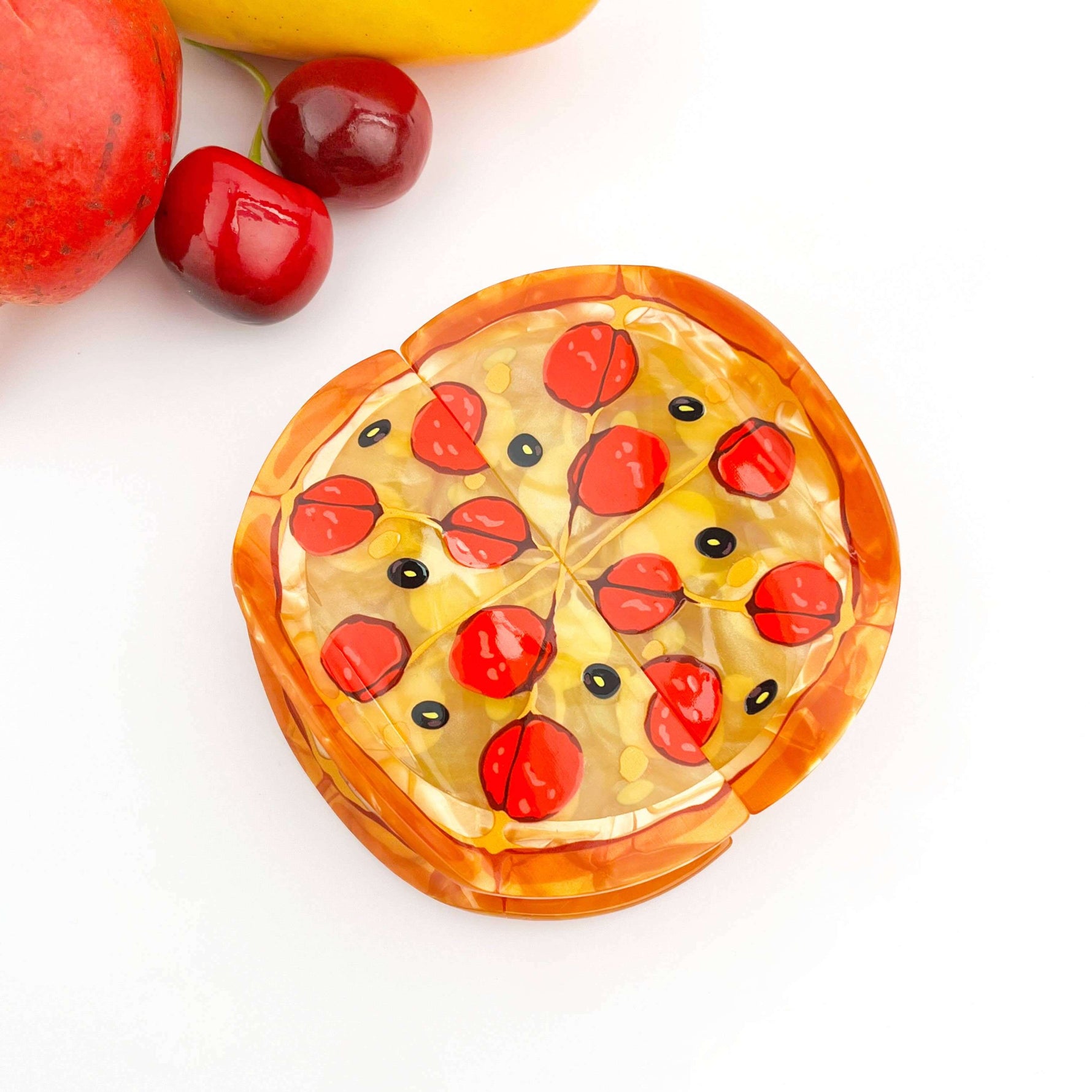 Pizza hair claw clip shaped like a pepperoni pizza, fun hair accessory for playful styling.