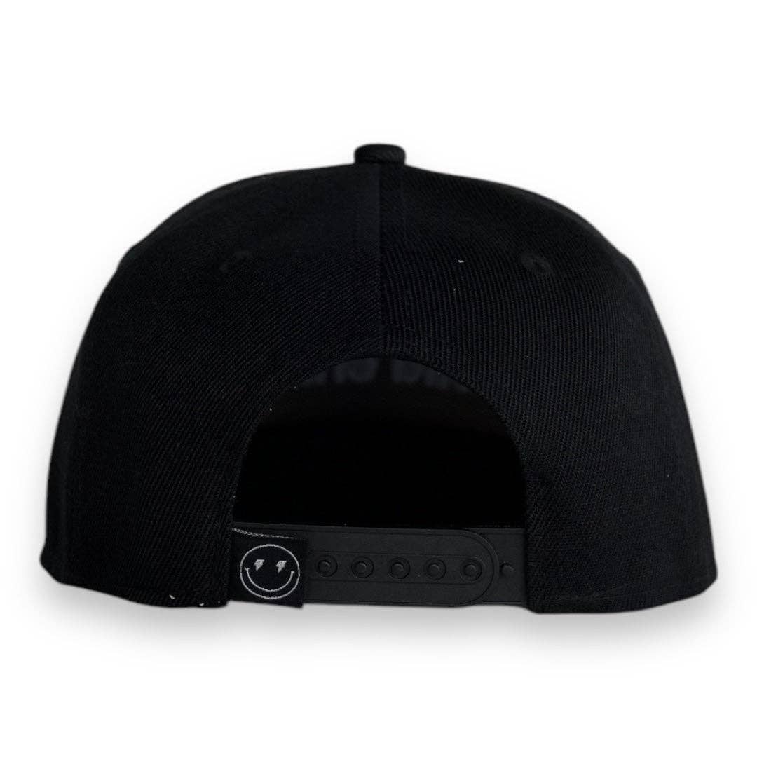 Back view of a toddler snapback hat showcasing adjustable snap closure and sleek black design.