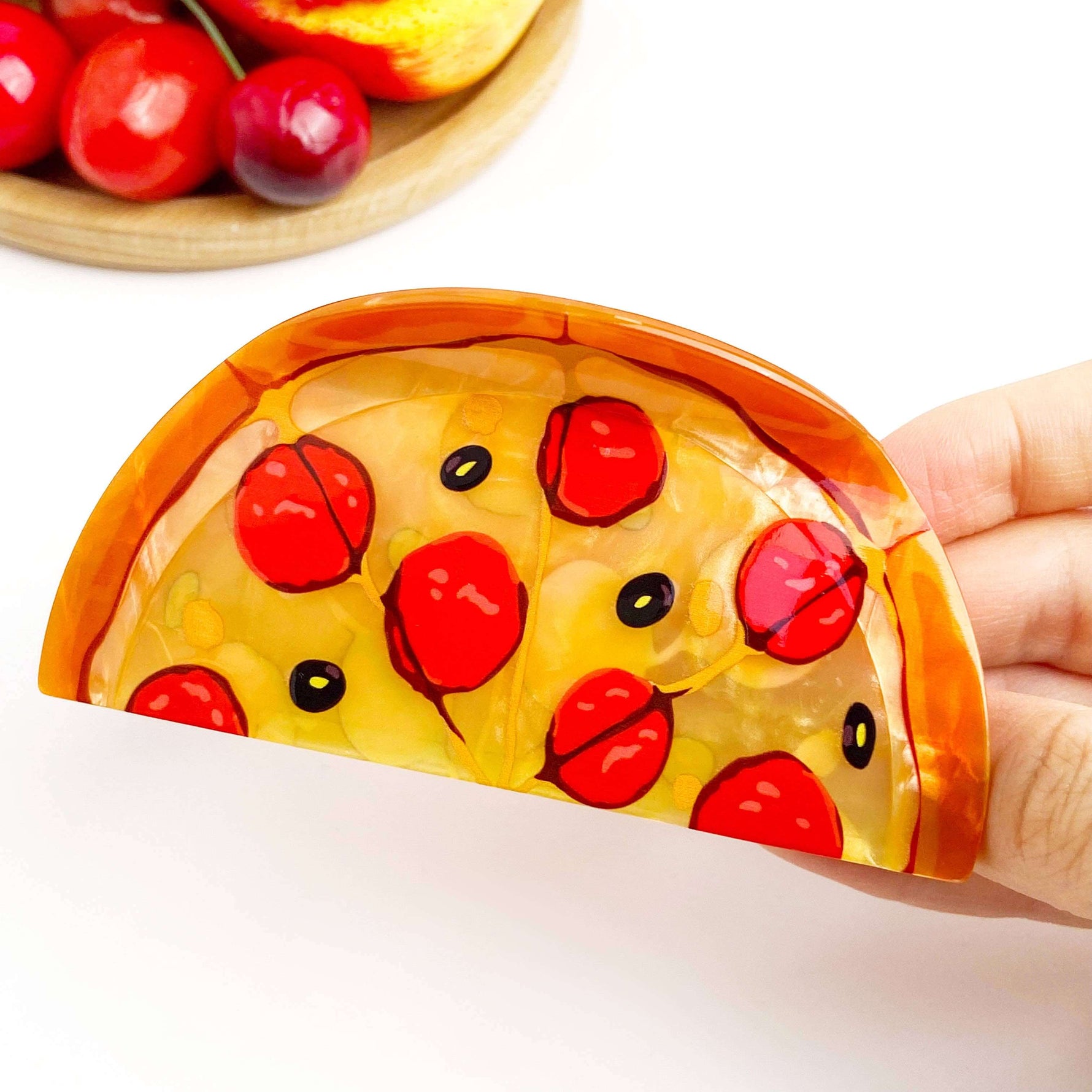 Pizza hair claw clip featuring a colorful ham pizza slice design with pepperoni and black olives.