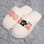 Dog mom indoor slippers with cozy white fabric and playful lettering for dog lovers at home.
