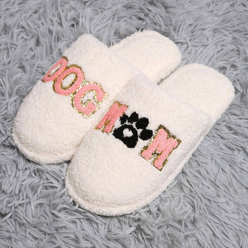 Dog mom indoor slippers with cozy white fabric and playful lettering for dog lovers at home.