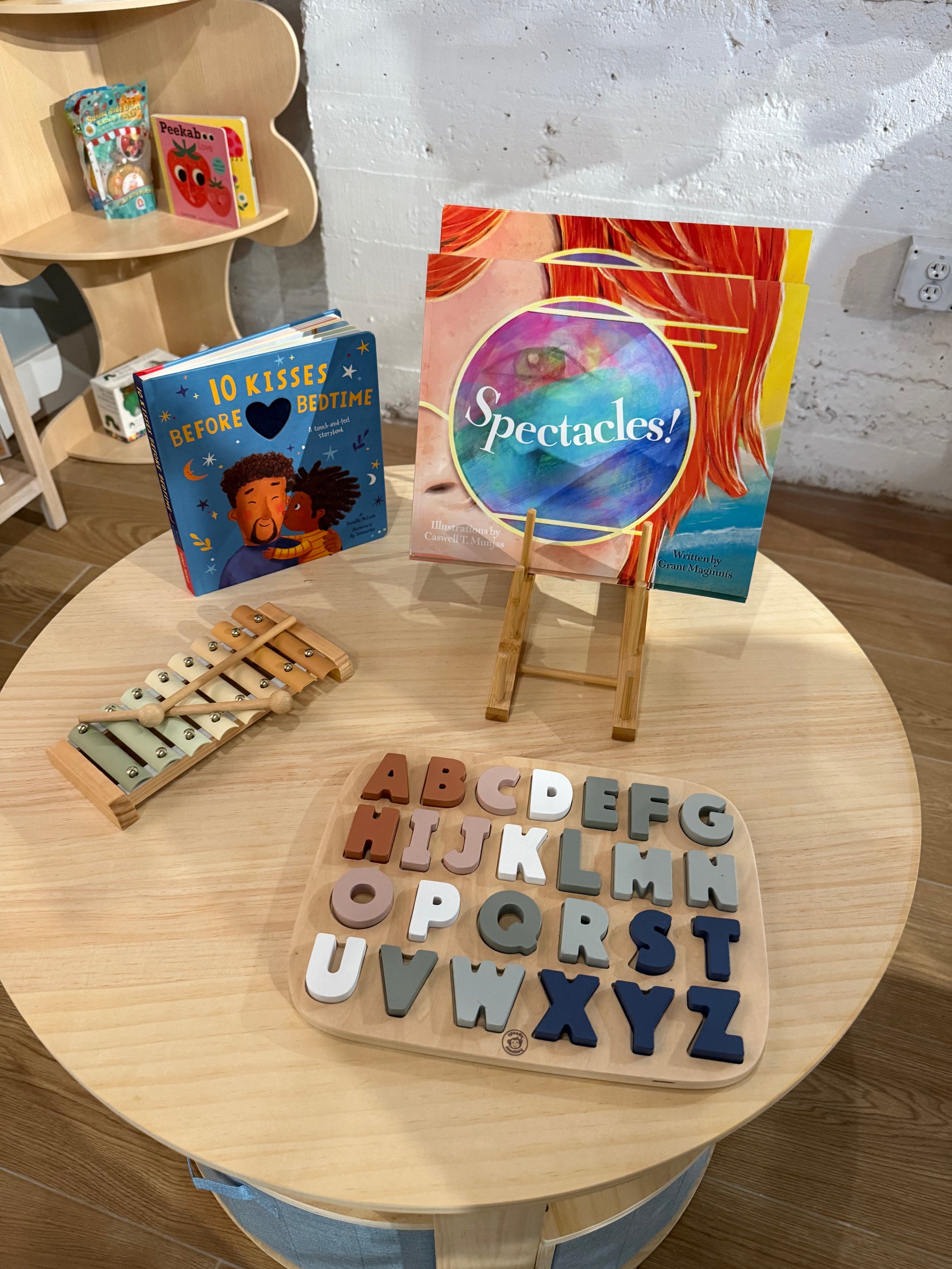 Spectacles childrens book on a table with other books