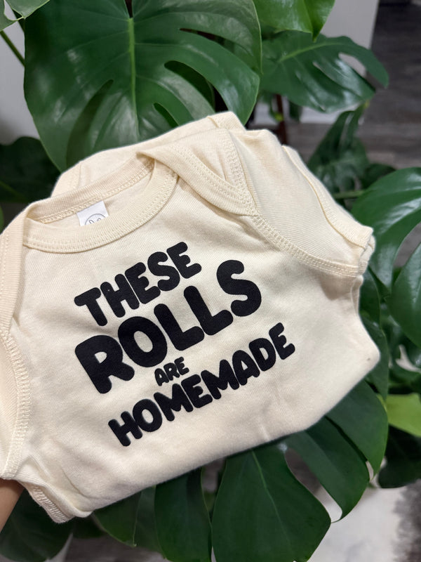 THESE ROLLS ARE HOMEADE BABY ONESIE