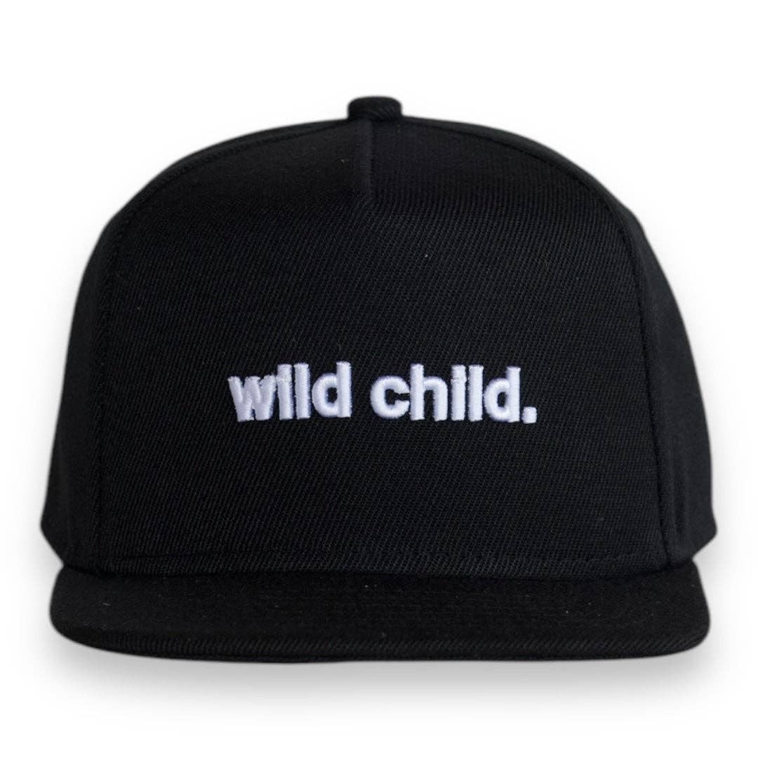 Toddler snapback hat featuring 'wild child.' embroidered in white on a black cap, perfect for energetic little ones.