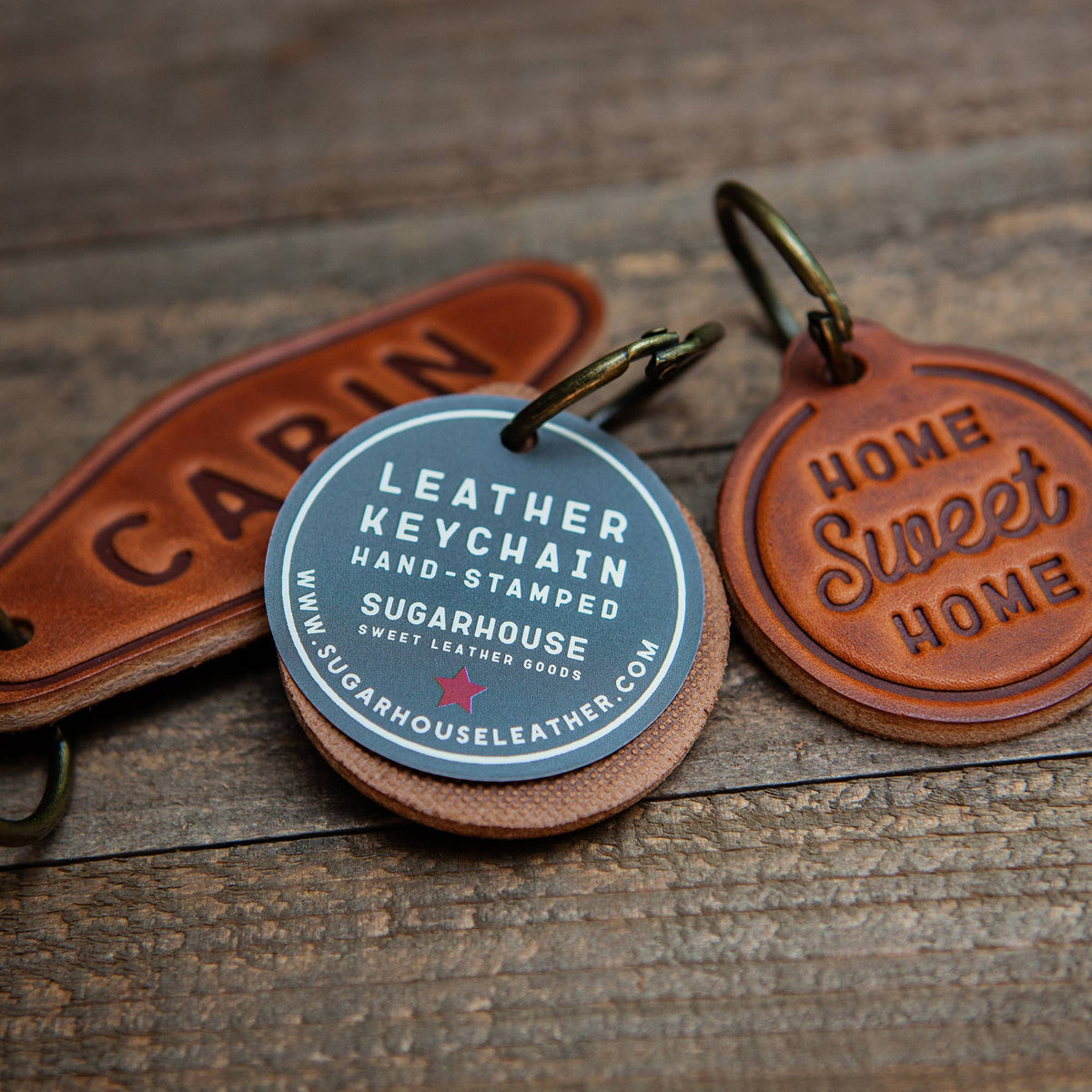 Leather keychain motel style with hand-stamped designs showcasing unique travel culture.