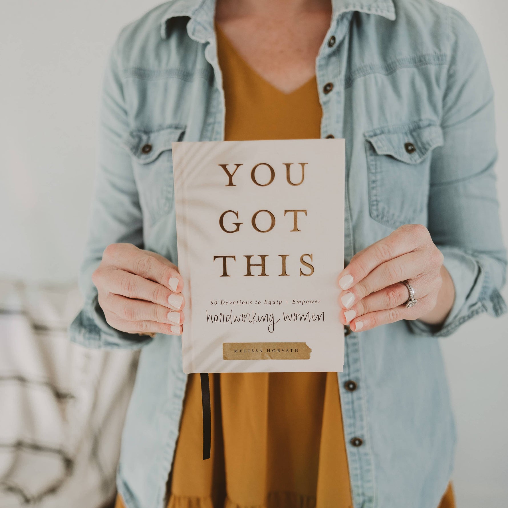 holding the women devotional journal